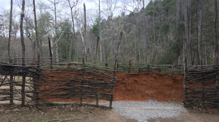 the wooden frame of a palisade could be covered with mud to create a more-effective and fireproof wall