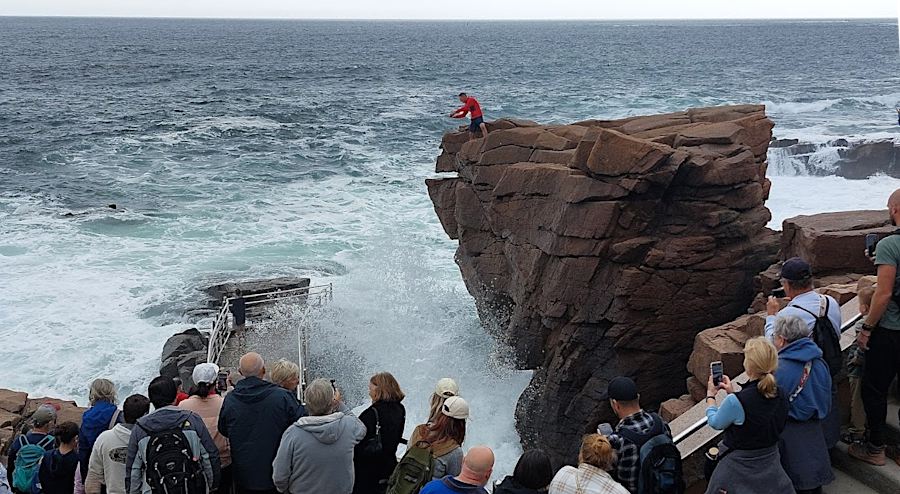tourists at Acadia National Park assemble t Thunder Hole 1-2 hours before high tide