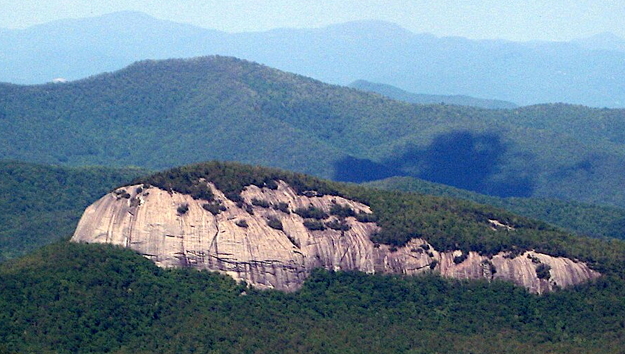 plutons once buried as much as 5 miles deep, such as Looking Glass Rock, have been exposed by erosion