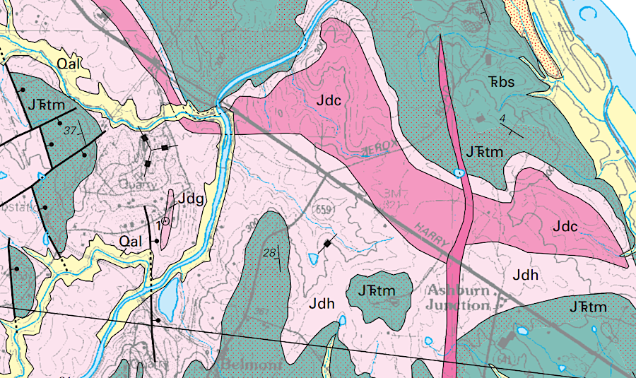 Jurassic/Triassic dikes and sills (red and pink) metamorphosed calcium-rich cobbles into marble, in places coded as 