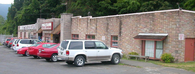 the entrance to Dixie Caverns is a functional structure with minimal esthetic appeal, and many stalactites in the commercial cave have been broken off
