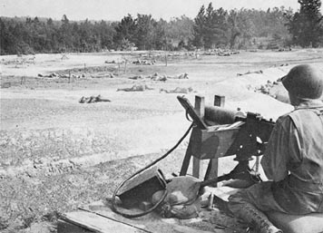 trainees negotiated the obstacle course at Camp Pickett under live machinegun fire