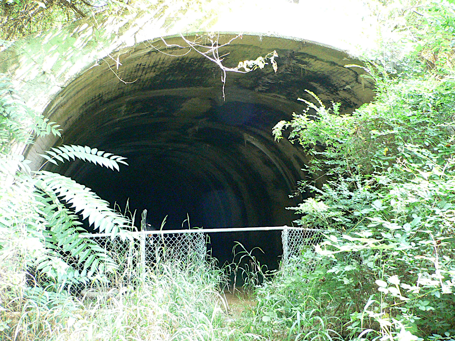 a concrete wall was built about 100 yards inside the eastern entrance to the Church Hill Tunnel