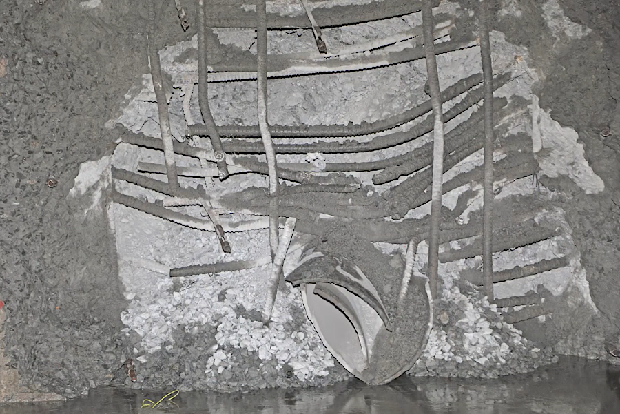 multiple blasts were required to remove the rebar-reinforced bulkheads
