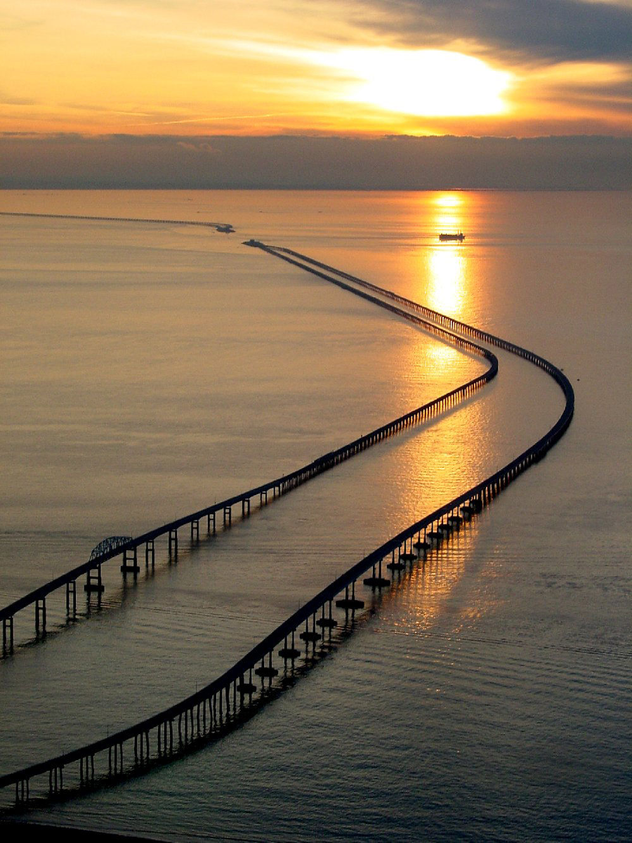 curving south from Fisherman's Island, where the North Channel Bridge offers an alternative for small ships to avoid the Chesapeake Channel