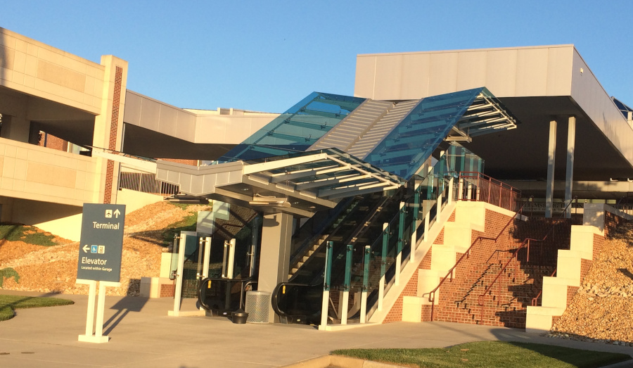 an escalator leads up to the Newport News/Williamsburg International Airport (PHF) terminal