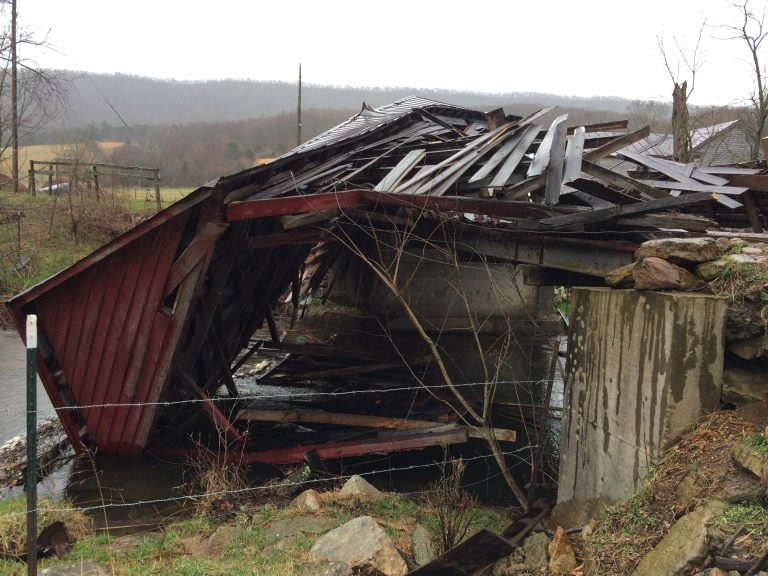 a 2017 windstorm blew down the wooden cover for the C.K. Reynolds bridge over Sinking Creek in Giles County
