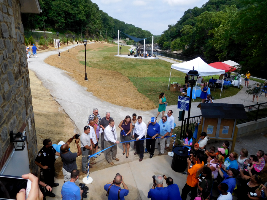 ribbon cutting opening River Mill Park on July 30, 2016 (Mayor Liz Quist holding scissors, Chair of Prince William Board of County Supervisors Corey Stewart on her right holding ribbon)