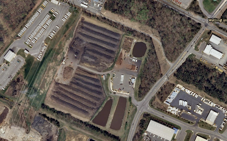 most of the planned site for the incinerator is now occupied by rows of mulch in various stages of production